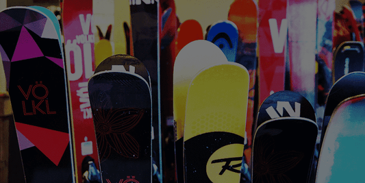 Multicolor Volkl and Rossignol skis lined up