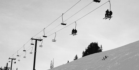 Skiers on a chairlift